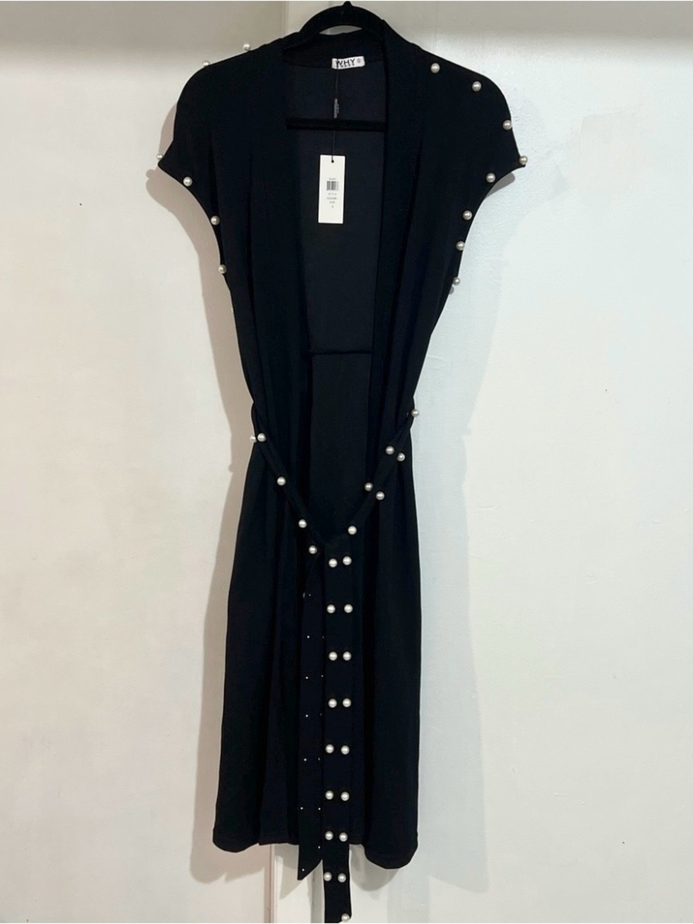 Why dress sleeveless black cardigan with pearl-accented trim with matching belt
